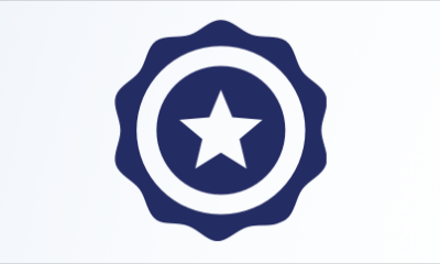 A shield icon with a 5 pointed star in the center of it.