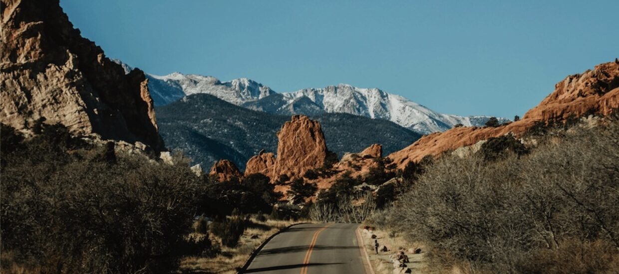 Report cover picture of road with mountains in the background
