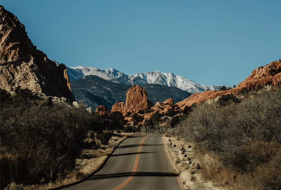 Report cover picture of road with mountains in the background
