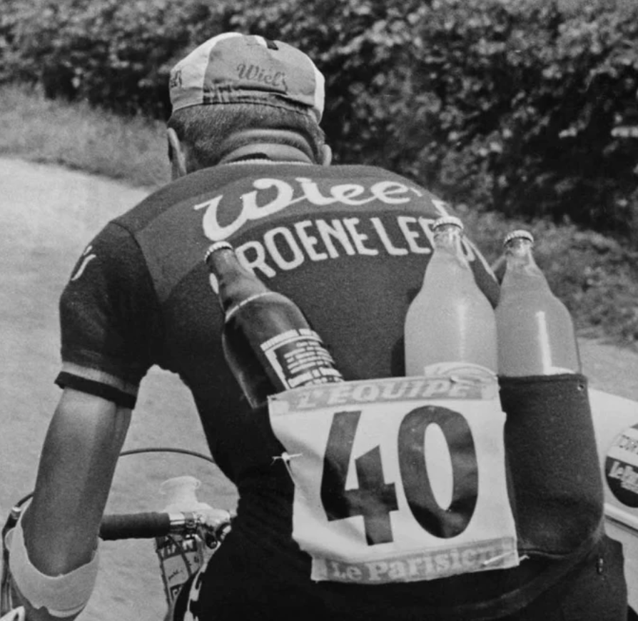 cyclist with beer bottles in jersey pockets