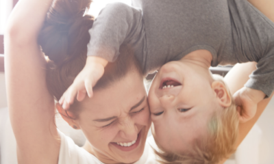 Mother and toddler laughing
